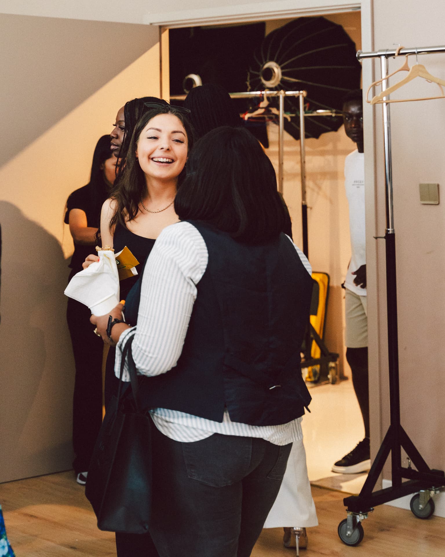 Guests greeting each other at the event entrance