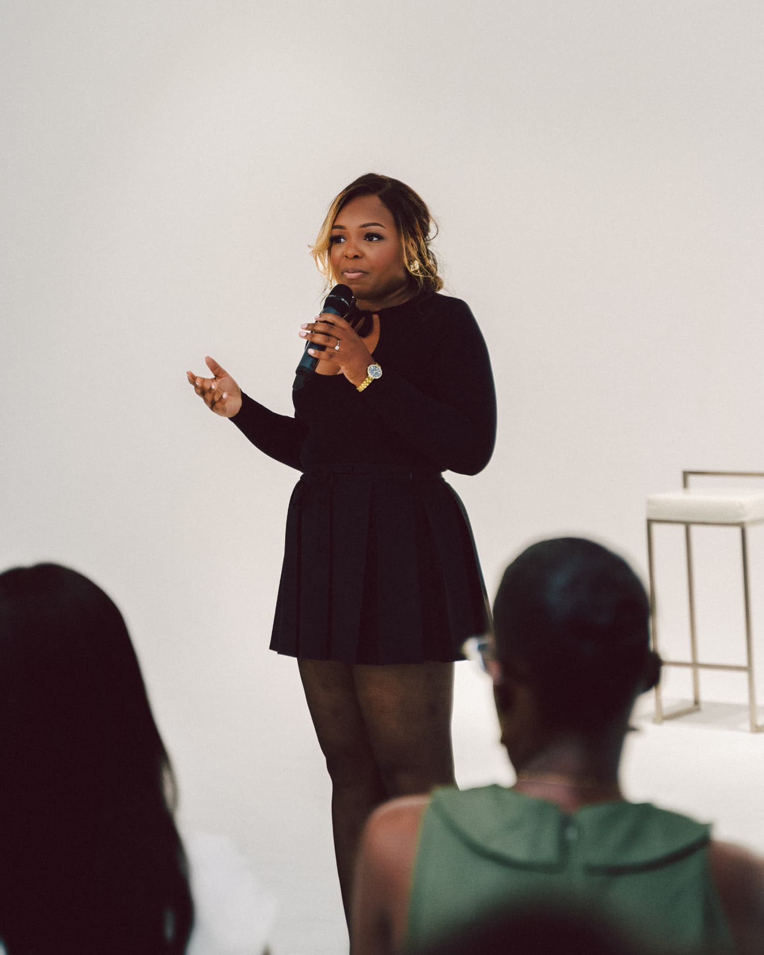Founder delivering a talk to the seated cohort