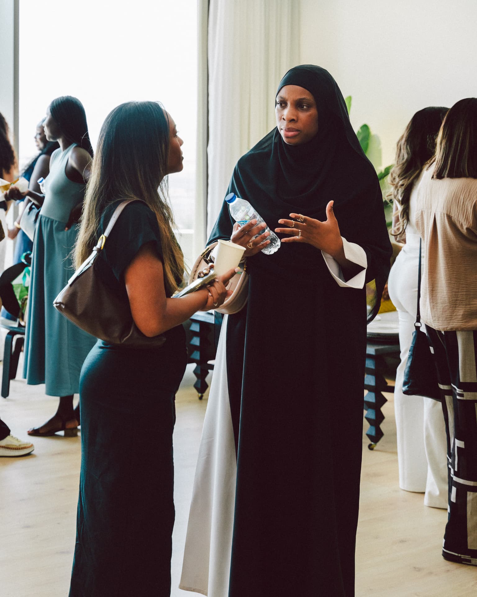 Two attendees in conversation during a networking break